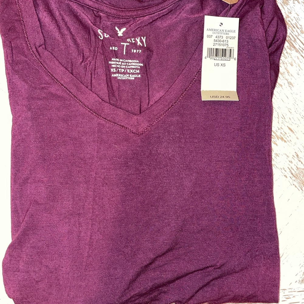 BRAND NEW Women’s maroon/plum v-neck size xs